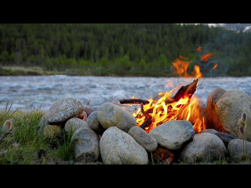 Place rocks around your survival campfire.