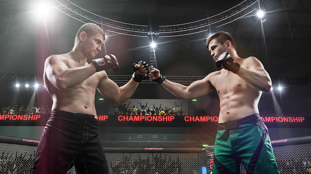 Two MMA fighters touch gloves, ready to go to battle!