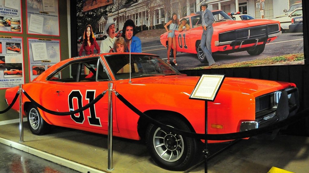 Bo, Luke and Daisy Duke in front of the 1969 Dodge Charger classic!