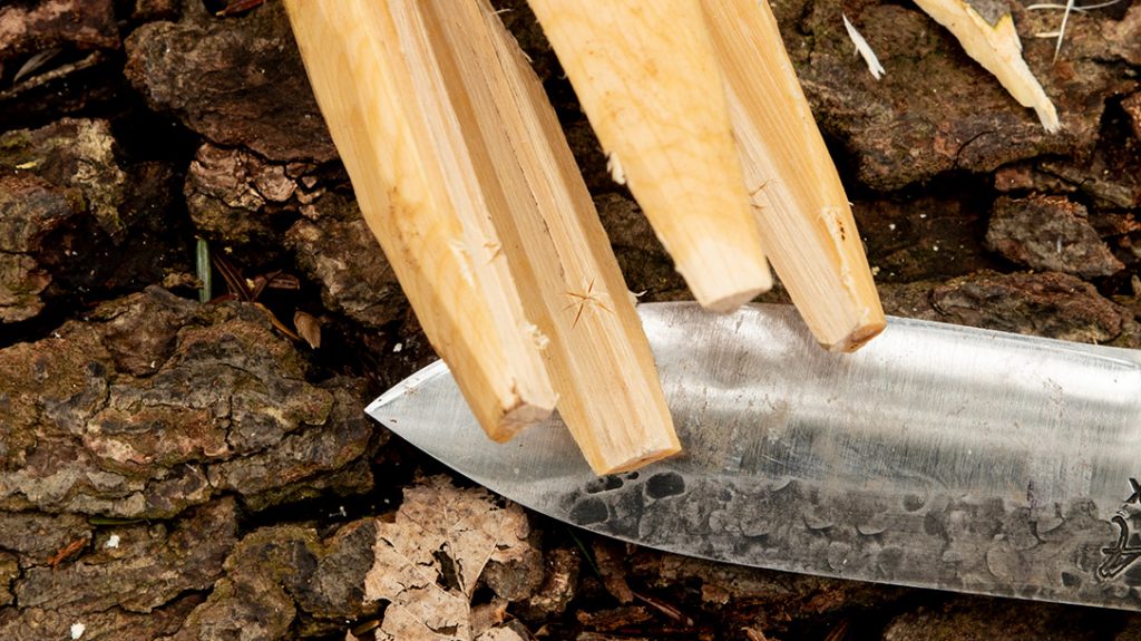 Start working on the barbs by cutting a small X into each tip. This will provide the shape of the barb. I start shallow and deepen it as I go.