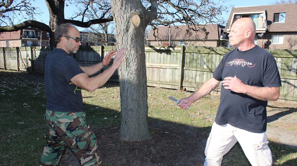 No matter what your attacker is armed with, get your hands up and ready to defend.