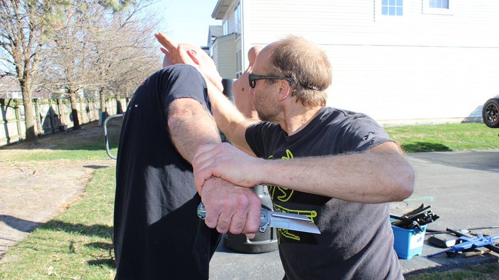 Reverse view of the forearm strike to the carotid artery.