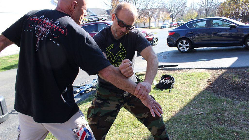 Rapidly hammer-fist the knife-wielding arm as hard as you can as many times as needed to make him drop the knife.