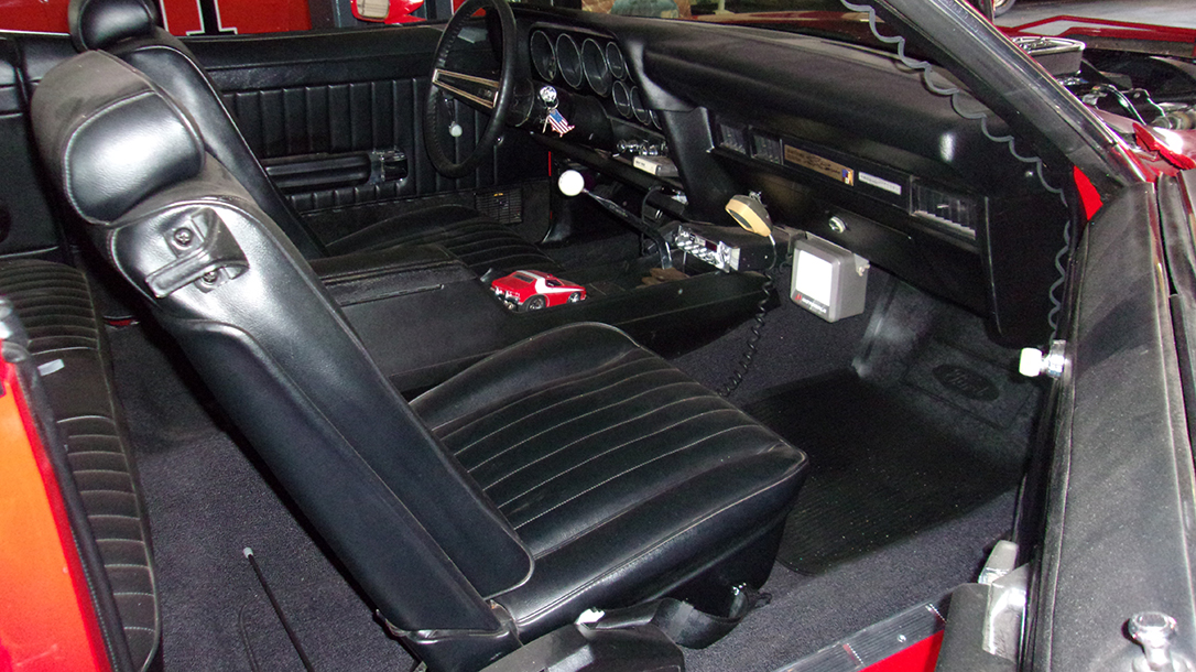 The interior of this 70s muscle car has all the creature comforts of the era two cops might need.