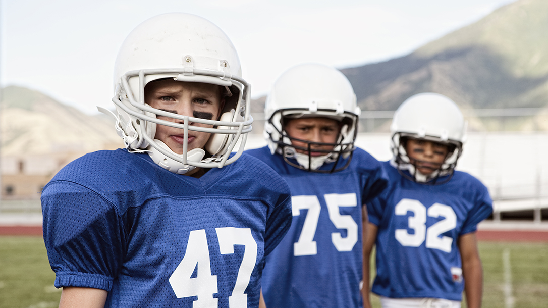 Football players on the field, training to be the best in youth sports!
