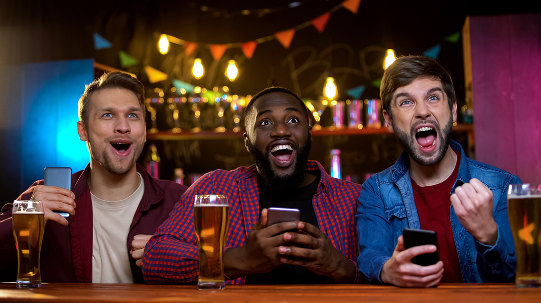 Friends meet at the bar to place their bets!