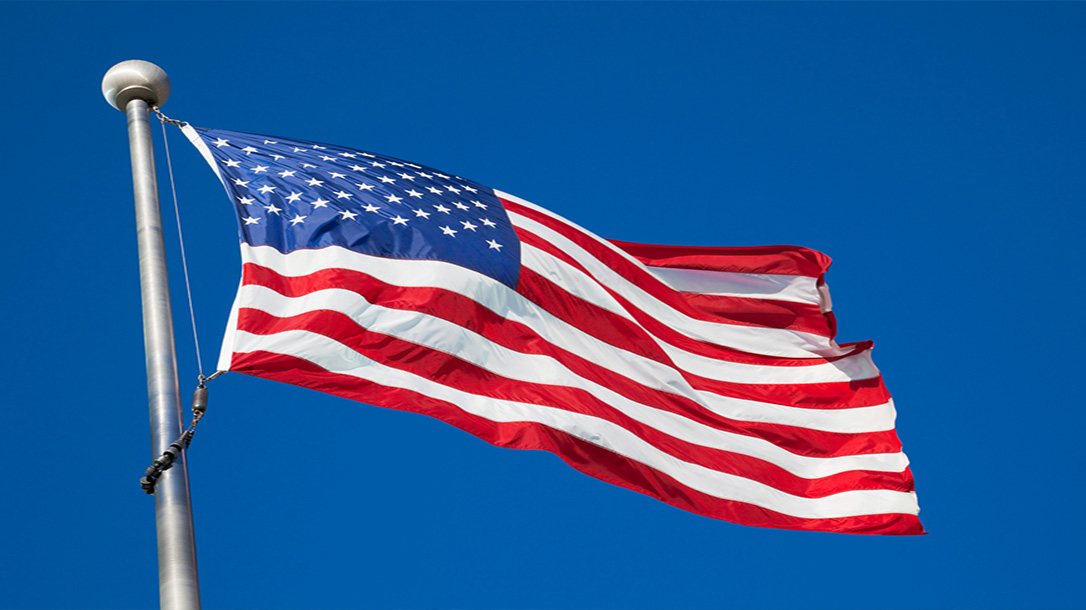 Proudly flying the United States flag overhead in his suburban HOA.