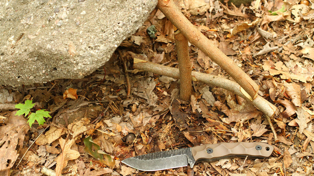 The figure-four is the author's preferred method to test knives, as it reveals details about their comfort and edge geometry. By utilizing this technique, one can gain insights into the nuances that define a great blade.