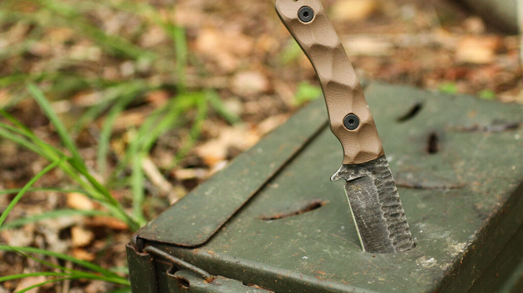 The Stroup GP2 endured harsh conditions, being plunged into an ammo canister before being beaten a few inches in with a baton. The edge was unharmed.