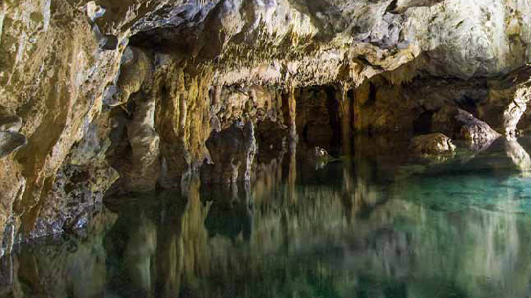 Exploring a cave with friend is a great way to enjoy a weekend adventure.