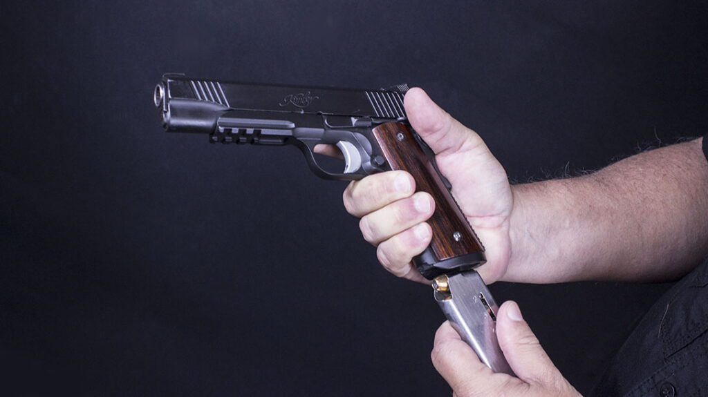 Move the pistol into your working space before inserting a magazine.