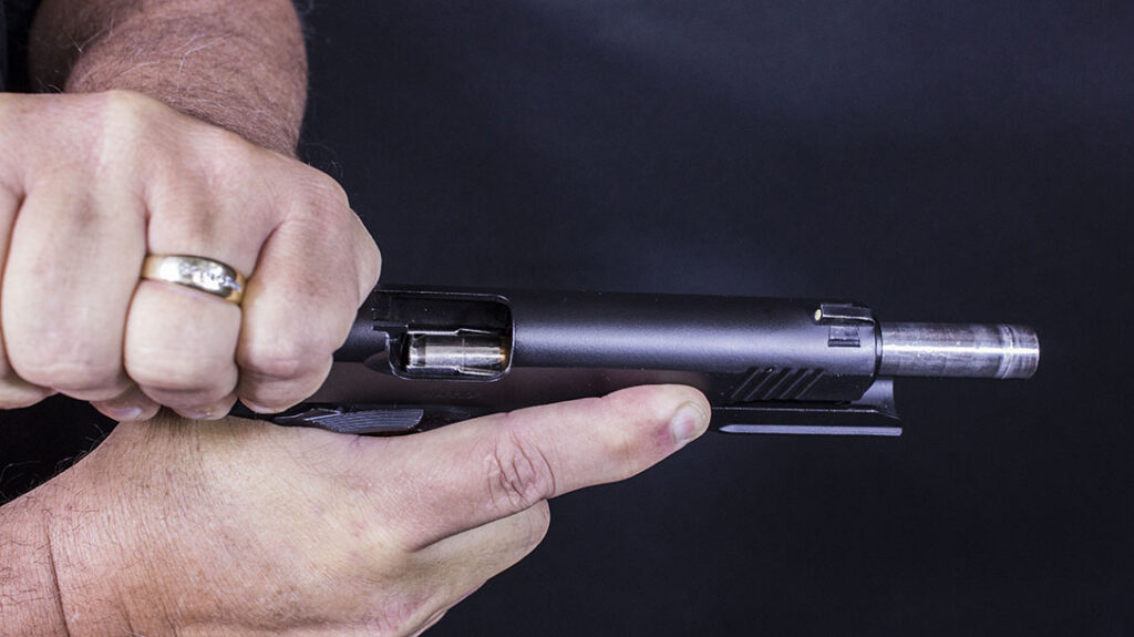 Rack the slide to chamber a round on a fresh magazine.