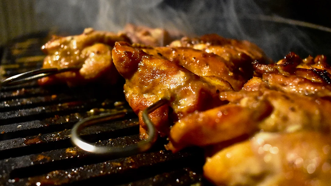 BBQ chicken skewers on the grill.