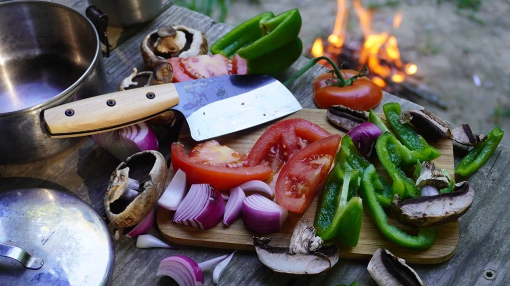 The Rombo's overall profile and edge geometry are reminiscent of a short Santoku or a miniature Serbian Chef's Knife.