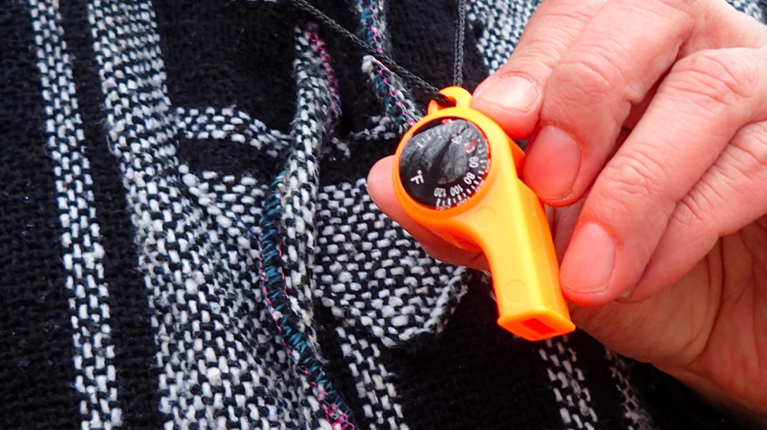 The author emphasizes the importance of carrying a whistle, such as the Sun Company 3-in-1 outdoor tool.
