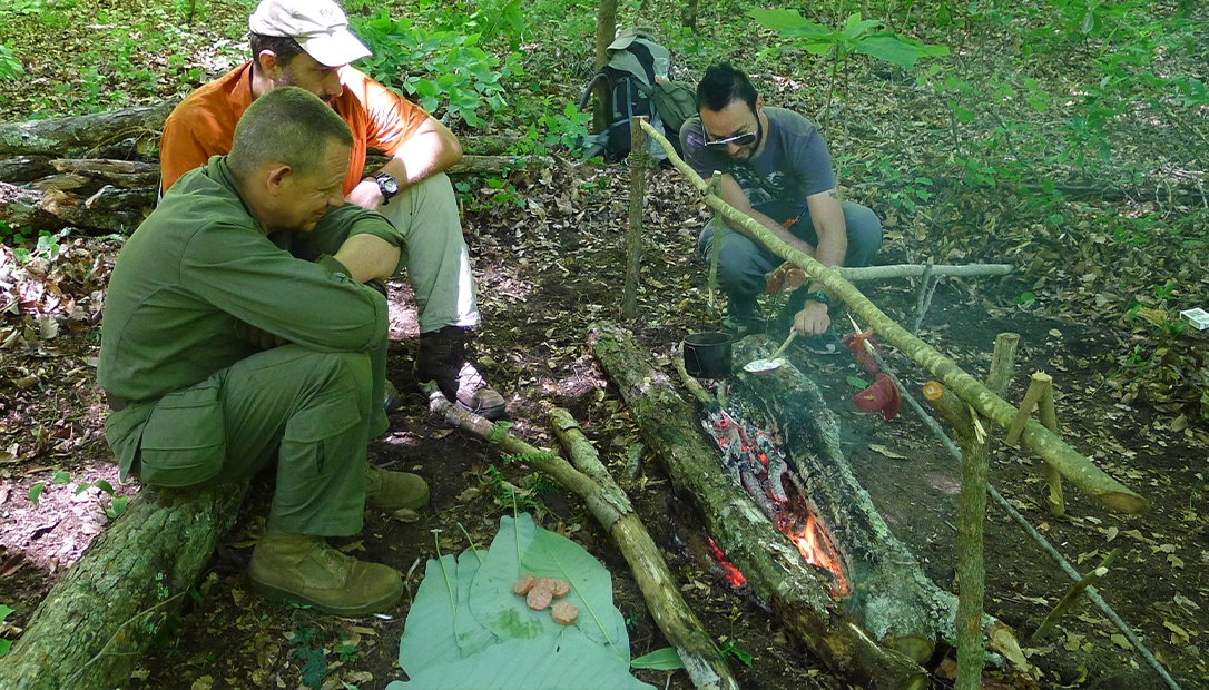 The author cooks for a larger cook party while the long fire establishes itself for the night.