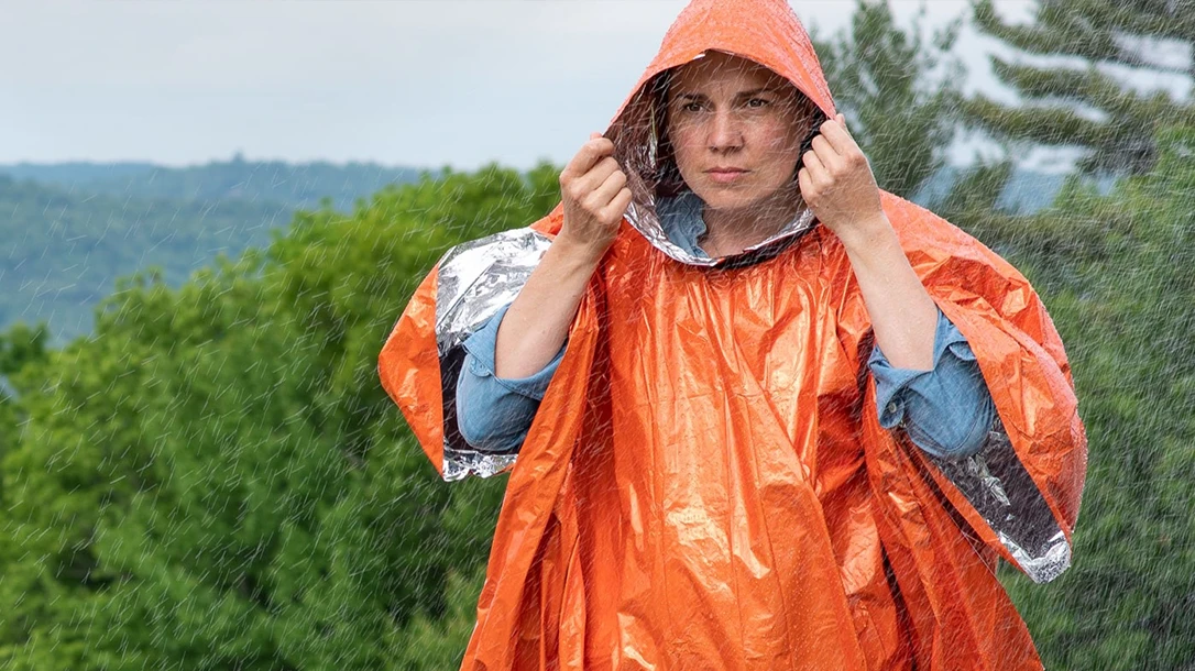 Passive signaling is wearing bright colors that get noticed on the move or in camp, like the SOL Heat Reflective Poncho.