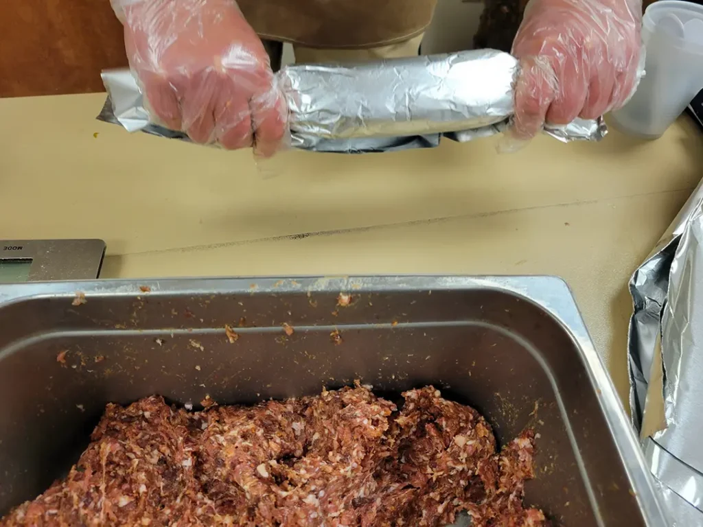 Rolling the sausage