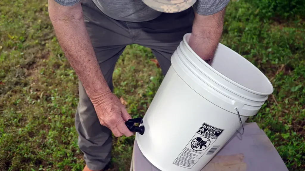 Installing the spigot in a DIY water filter