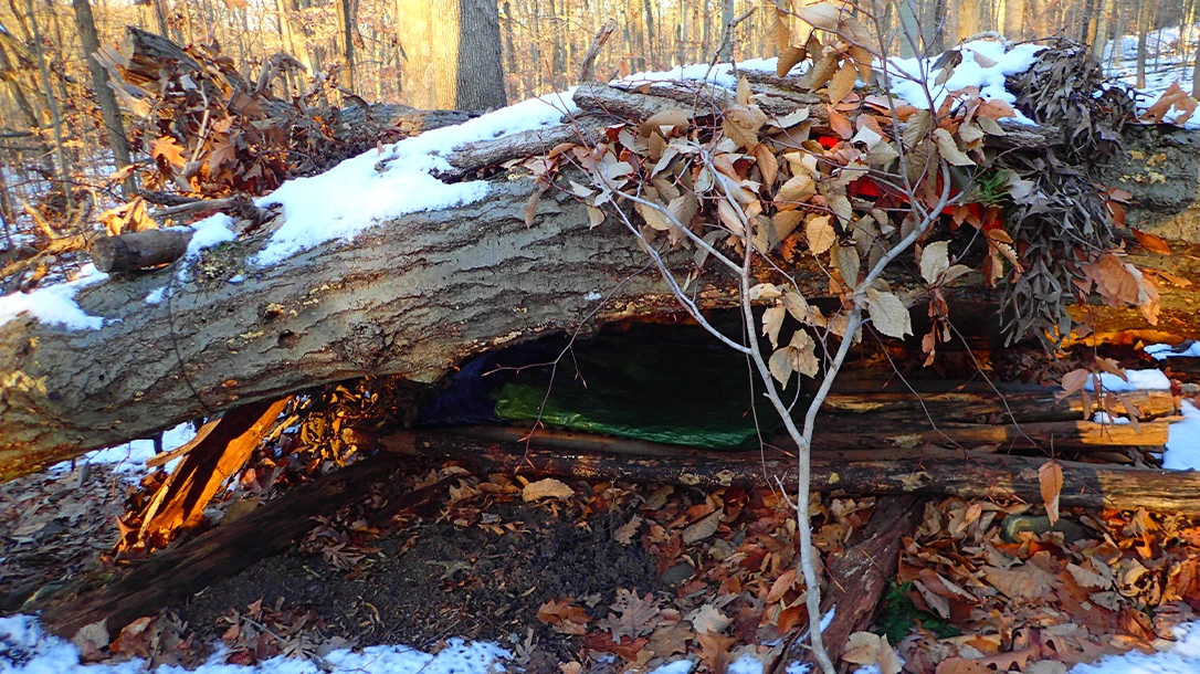 The author slept on a pole bed insulated with a closed-cell foam pad and heavy truck tarp.