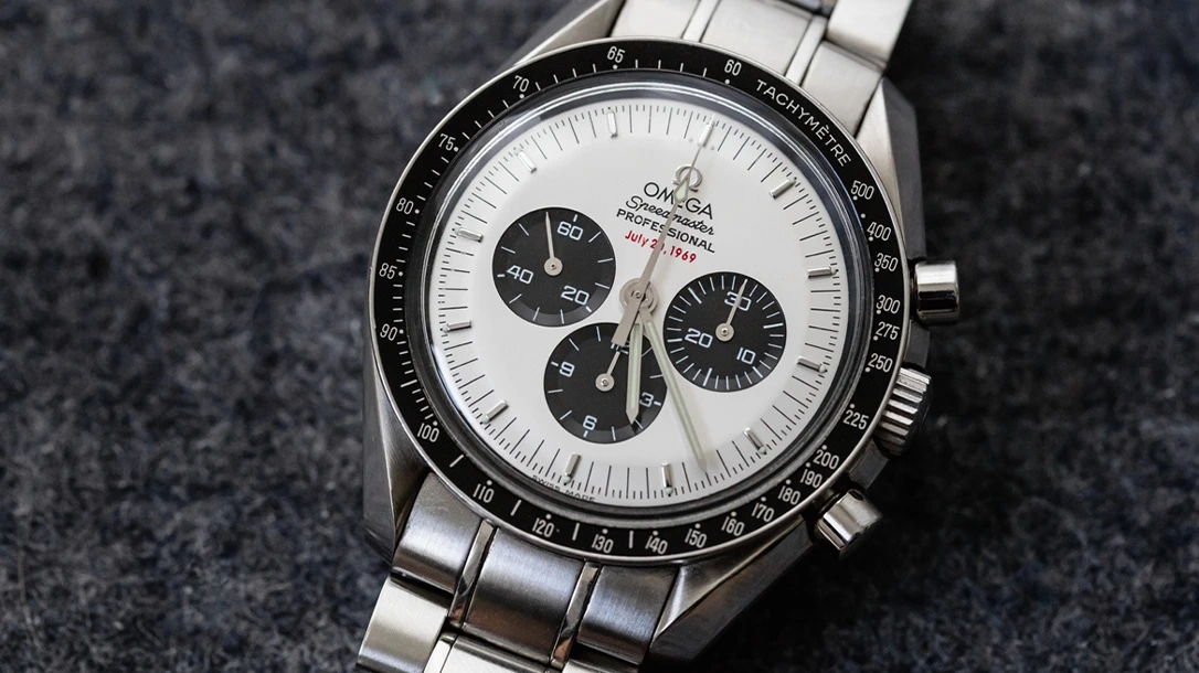 Omega Speedmaster Professional Apollo XI 35th Anniversary Chronograph with rare White Dial, black bezel and steel bracelet. The Speedmaster Apollo XI 35th Anniversary: Ref. SU 145.0227 is a very rare one, with its white ‘Panda’ Dial – a white face with black sub-counters. Under the mention Professional at 12 is written in red “July 20, 1969”.