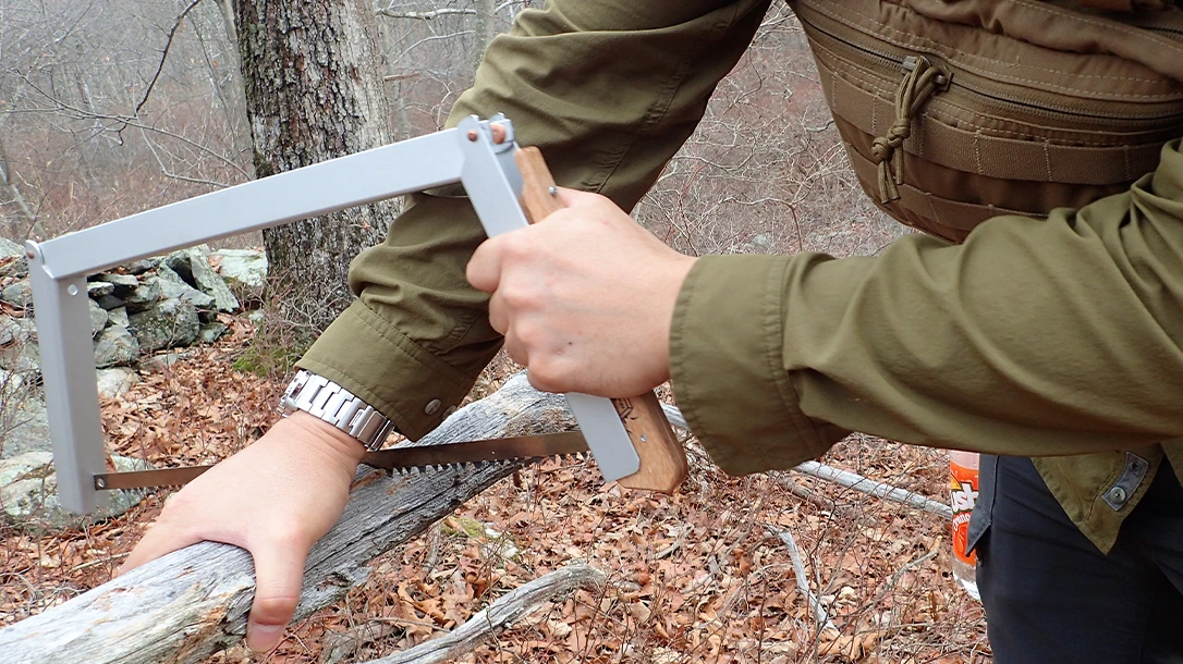 Do this. Reach over the saw blade to avoid the saw jumping out onto your hand.
