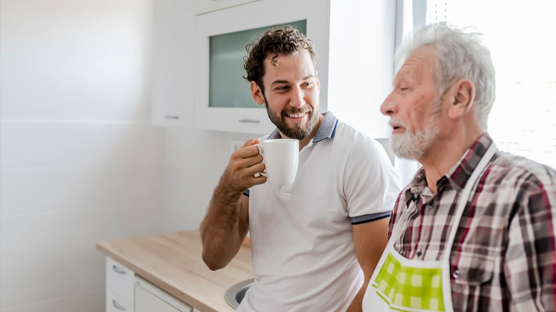 Sons and fathers enjoying a cup of a coffee.