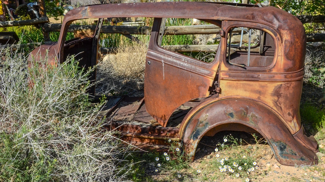 By the time the gunfire had ceased, the car was riddled with bullet holes.