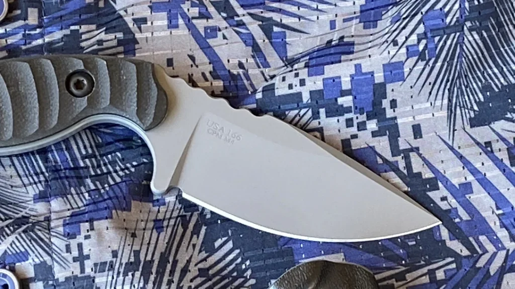 The blade features a full flat grind, providing a strong, thick spine while allowing the edge to be extremely thin and sharp.