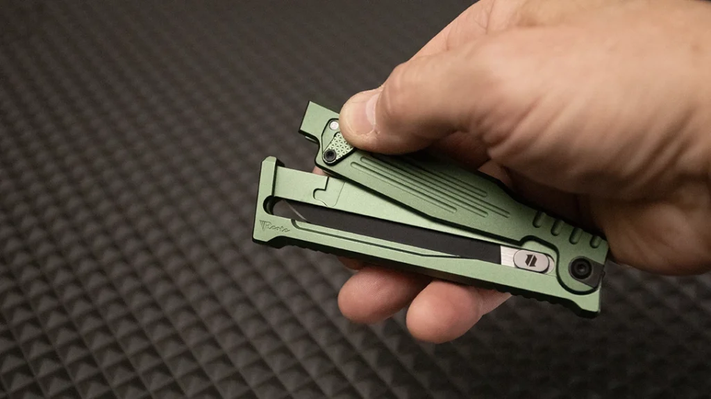 Then allow the lower handle half to pivot down.