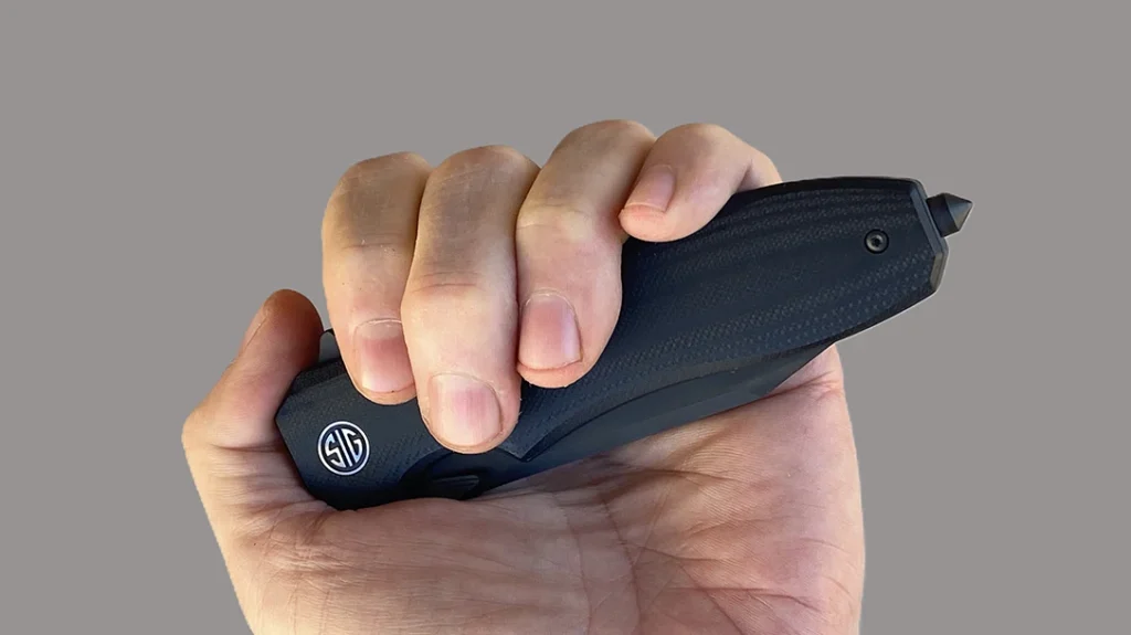 The SIG Sauer EIKONIC VALIDUS features a glass breaker for emergency personnel.