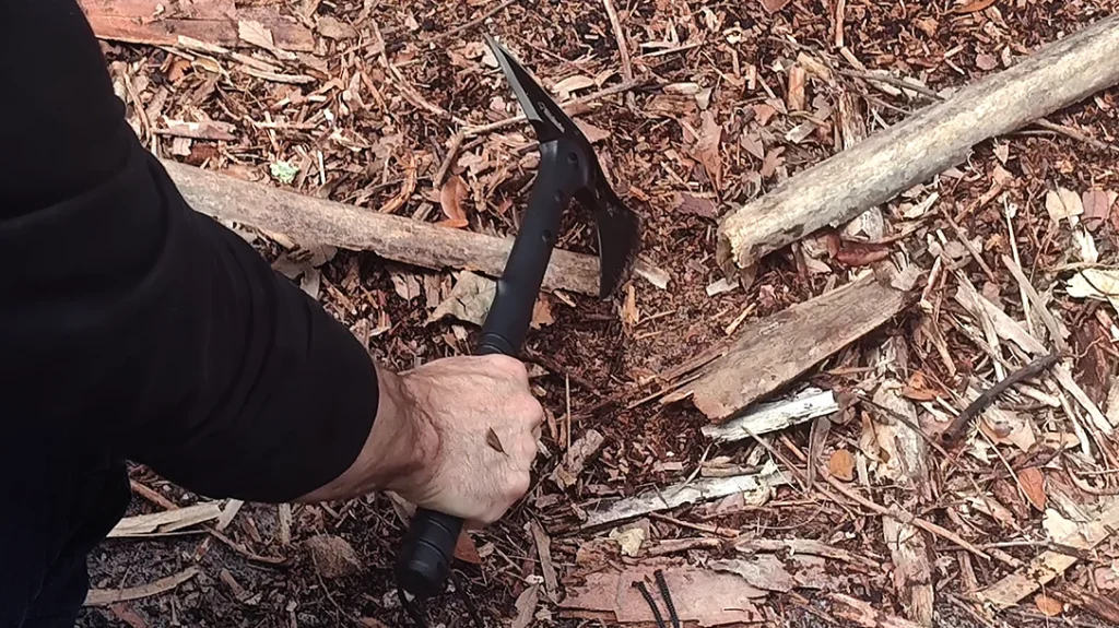 The cheap tactical tomahawk severed the dried palm frond, but only after several repeated powerful strikes.