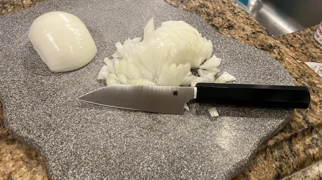 The Petty blade does its role in chopping up an onion.