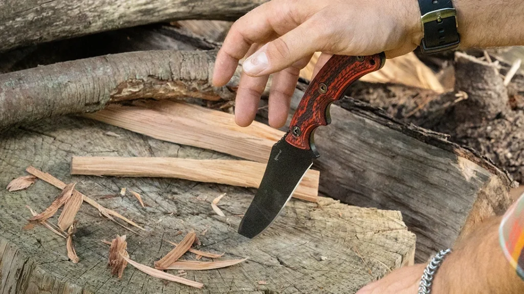 The author’s sample wears deeply textured, G-10 Diamond Back scales in red and black.