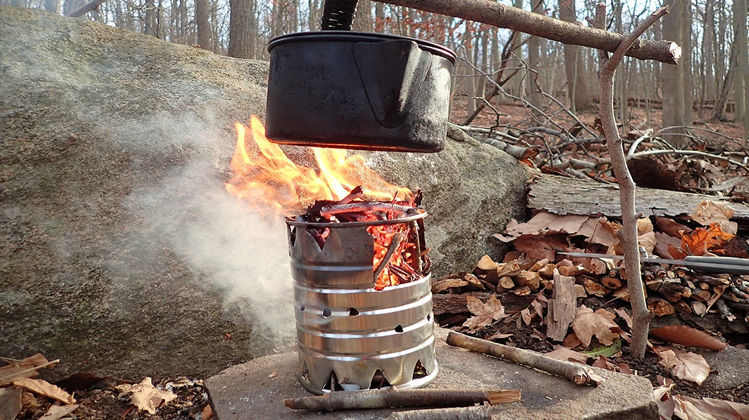 A hobo stove is an invaluable apocalyptic BBQ tool in the arsenal. Hang it and use the open flame to heat liquids and stews.