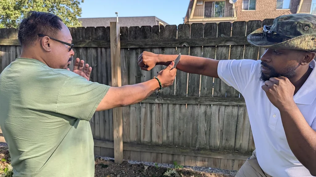 Cass attempts to punch Frank, and Frank delivers a counter cut to Cass’s arm.