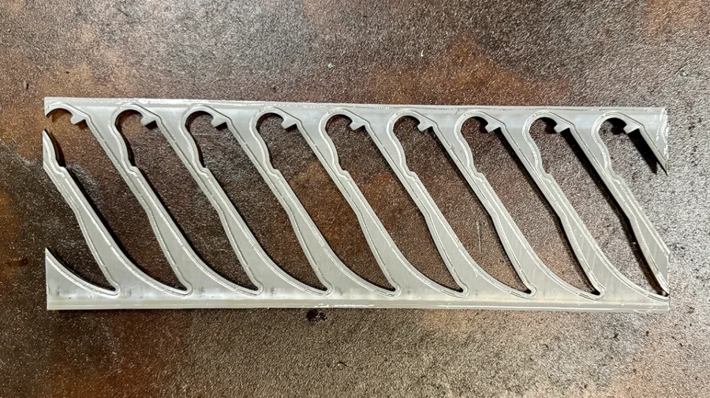 Steel sheet with blades punched out.