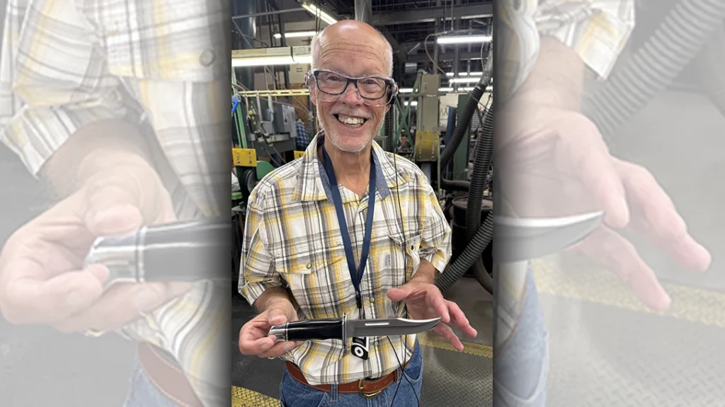 Author displaying the Model 119 knife he hand-sharpened.
