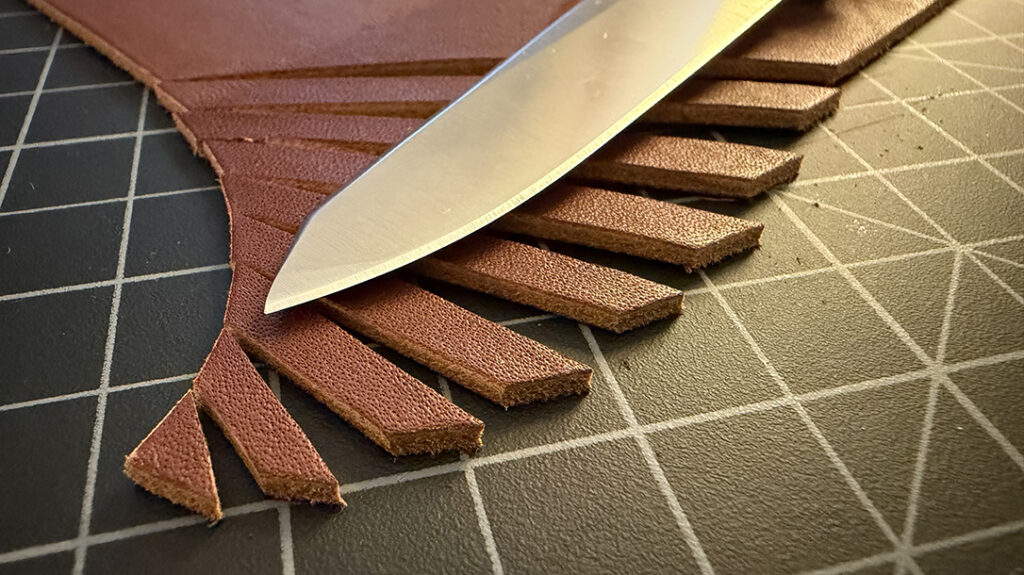 The unique tip delivers a lot of pressure. So, I pulled out a section of heavy-duty leather and performed a series of slices using only the tip.