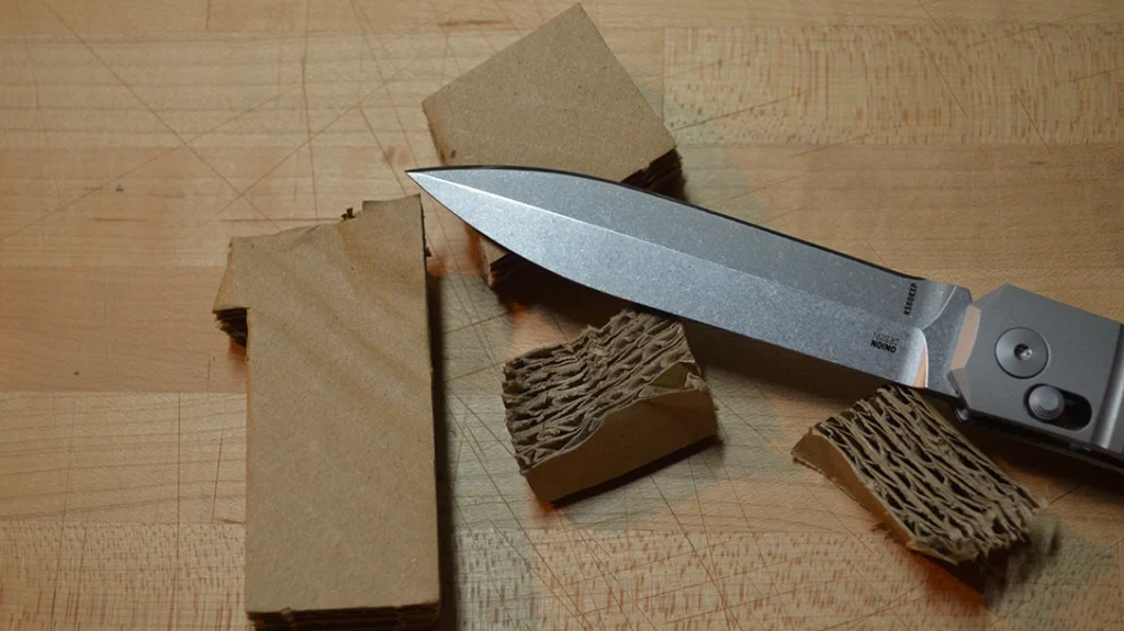 Thick cardboard was problematic, simply due to the CRKT Redemption’s blade shape.