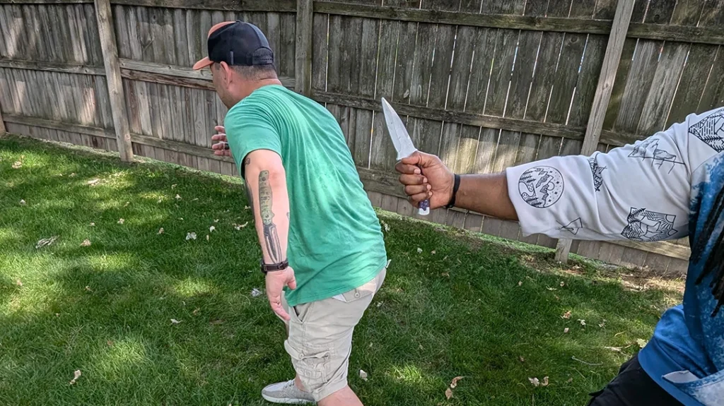 Knife Fighting Myths: The author turns to run “fade.”