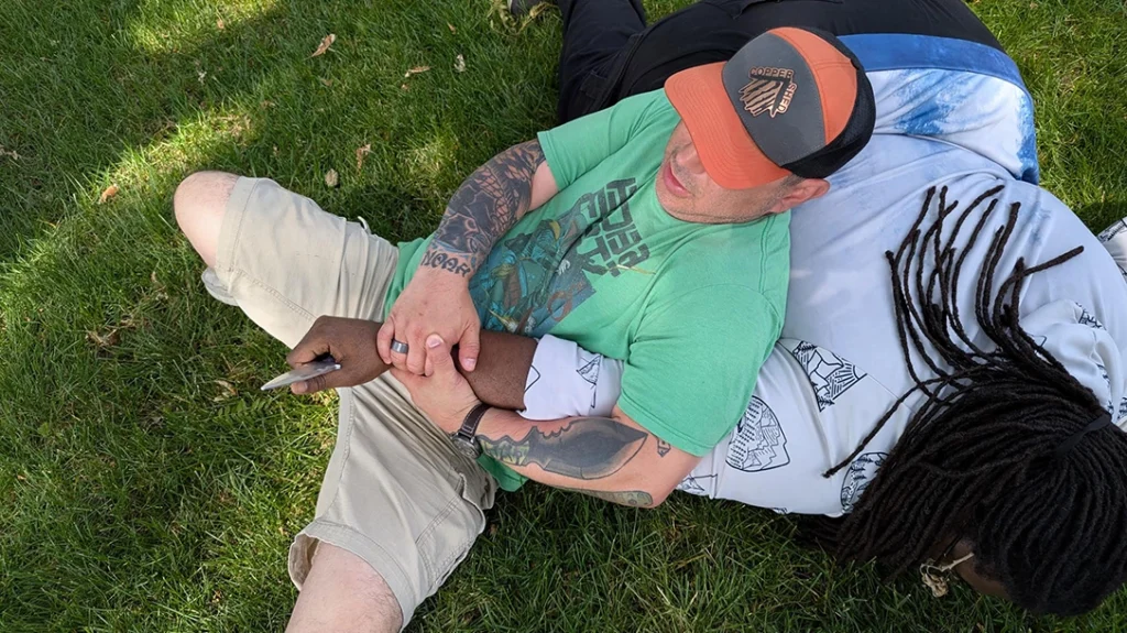 Do your best to lock up, isolate, and control the knife-wielding arm. The ground is your friend.