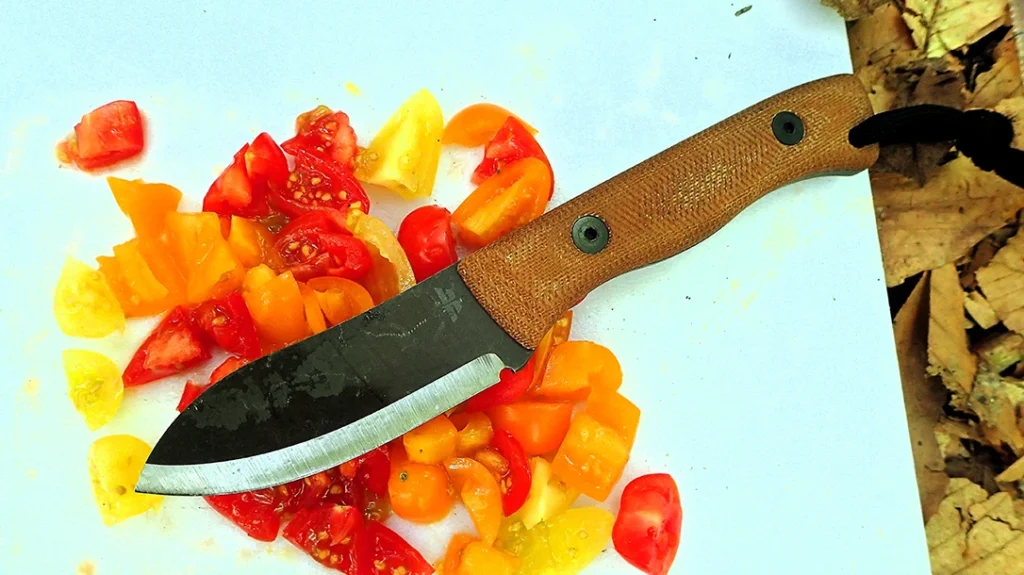 The author easily diced tomatoes with the KBN Cub-Muk, avoiding the dragging or smashing that can occur with dull or thick blades.