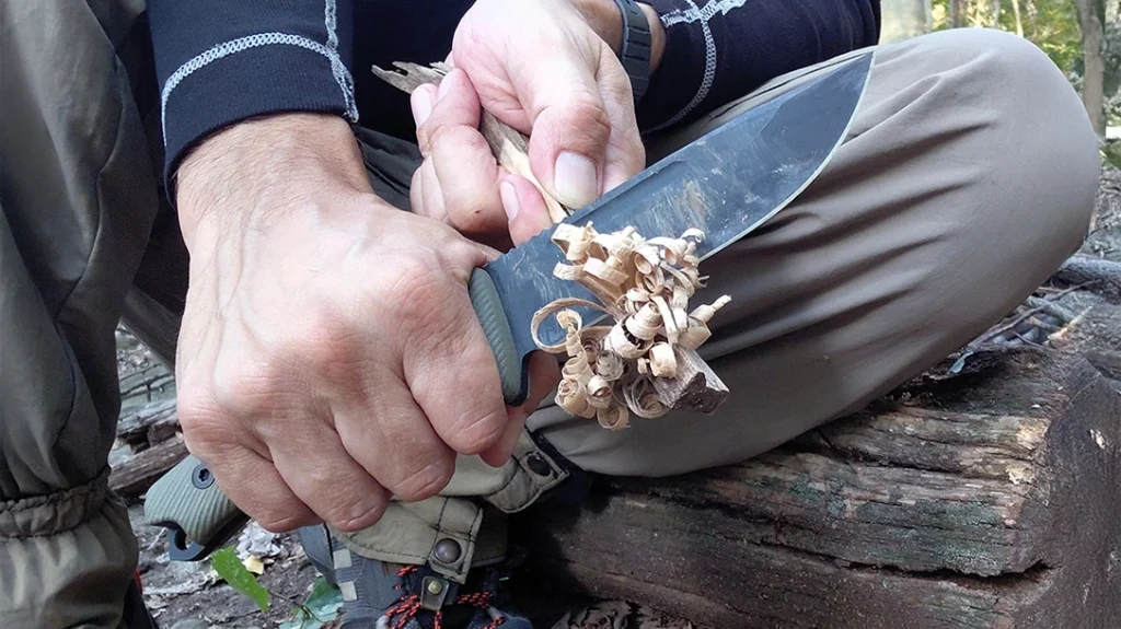 Carving thin, curly feather sticks was easy for the author using the knife's sharp edge.