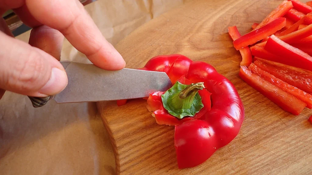 In the kitchen, the author found himself using a point grip, since the knives were shorter than those typically used there.