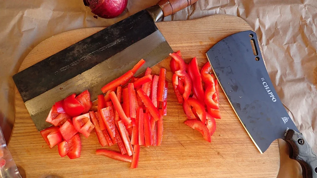 Chinese Veggie cleaver (top) and TOPS El Chappo cleavers slicing and making julienne peppers.