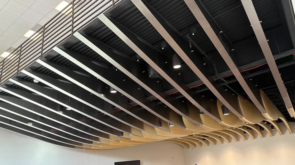 The hall is a large room with sound baffles hanging from the ceiling that share the aesthetics with Spyderco knives.