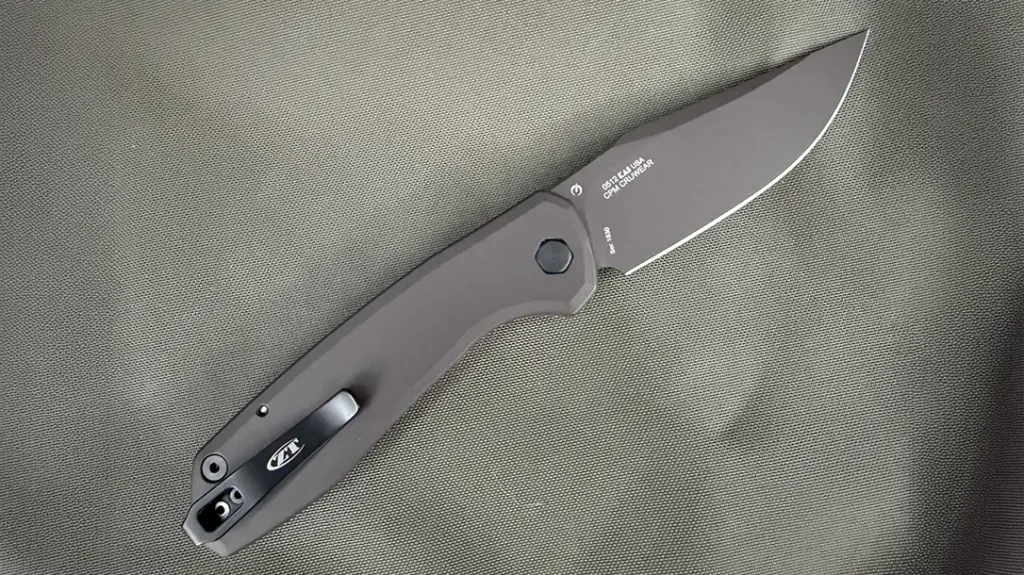 The back side of the handle is a solid piece of anodized titanium that is drilled and tapped for a low-profile pocket clip.