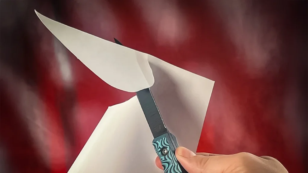 Out of the box, the knife was sharp enough to slice newspaper cleanly and twist through printer paper into a question mark shape.