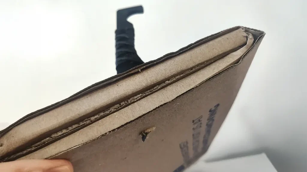 Folded heavy cardboard wasn’t a match for the Revenant Corps Talon V2’s incredible penetrating power.